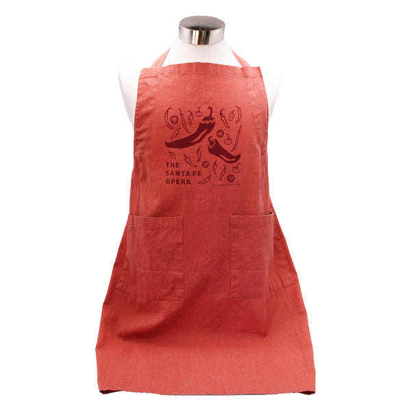 Image of a red apron with chiles and "The Santa Fe Opera' in dark red and two pockets.