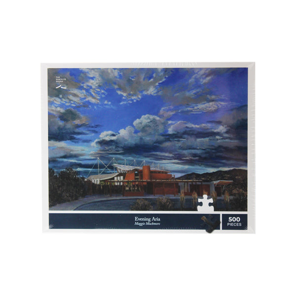 Image of a puzzle box with a painting of the Santa Fe Opera theater, surrounding landscape and sky.
