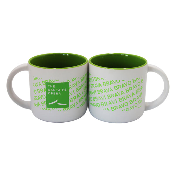 Green and white mug with green bravi, bravo, and brava, the Santa Fe Opera logo and a green interior.