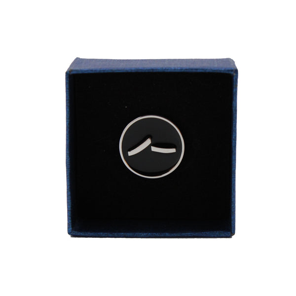 image of round santa fe opera pin
