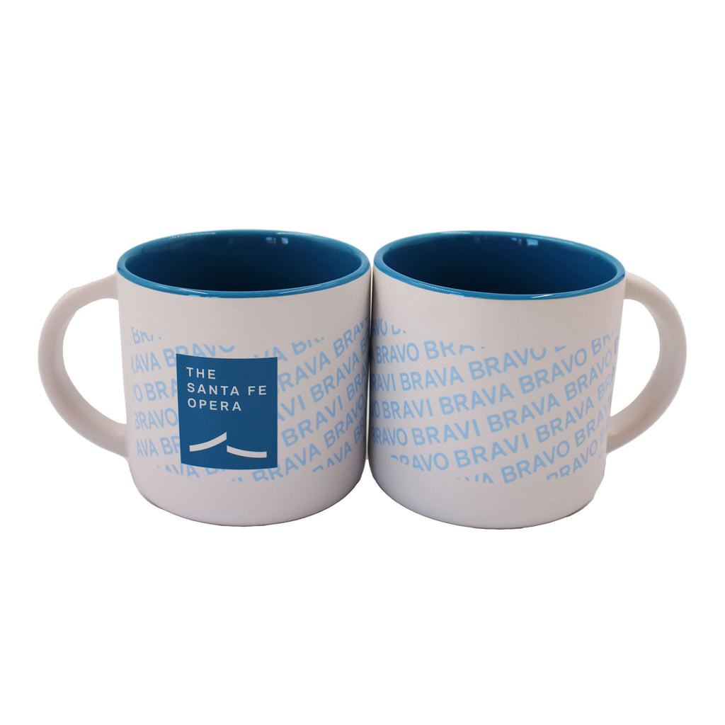 Blue and white mug with blue bravi, bravo, and brava and Santa Fe Opera logo. Inside of mug is also blue.