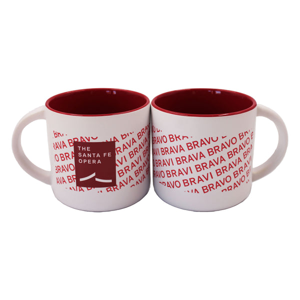 Red and white mug with red bravi, bravo, and brava and Santa Fe Opera logo. Inside of mug is also red.