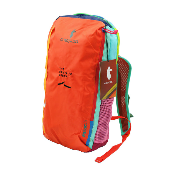Multi colored backpack with Black Santa Fe Opera logo.
