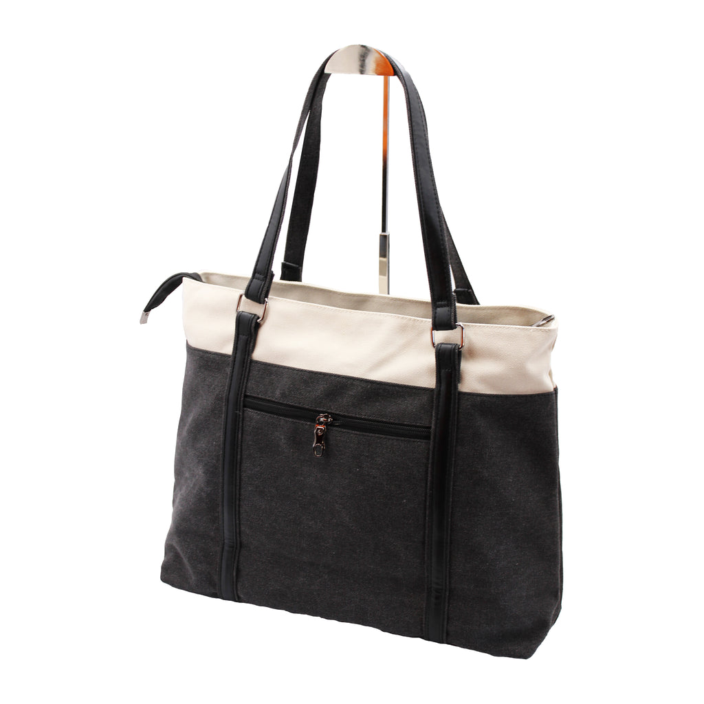 Black and cream tote bag with a handle and zipper pocket.